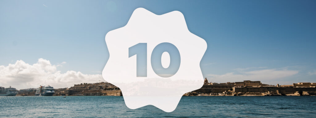 Ten over a scenic view of Valletta, Malta. Positive Impact UpSlide.