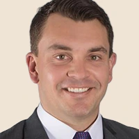 Professional headshot of a Cushman & Wakefield employee, showcasing UpSlide for Cushman & Wakefield.