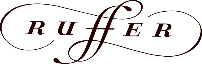 TotalEnergies UpSlide logo with elegant flourish design elements.