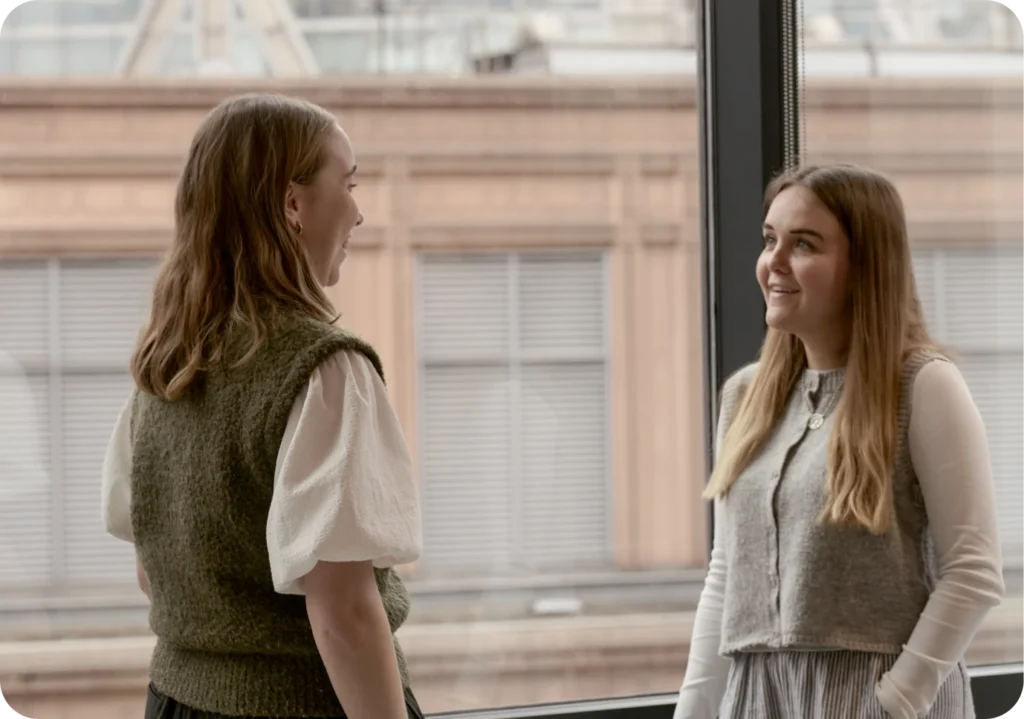 Woman reviewing documents, possibly related to software due diligence.