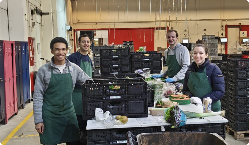 Four volunteers sort produce for upslide b corp food distribution.